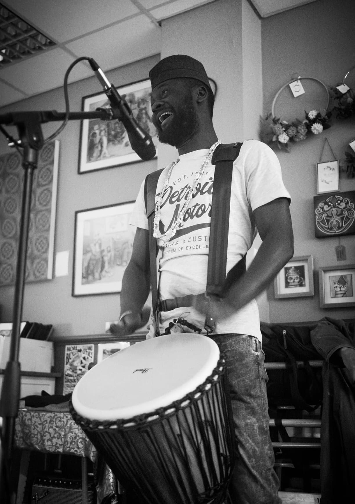 AfroSync percussionist playing the djembe